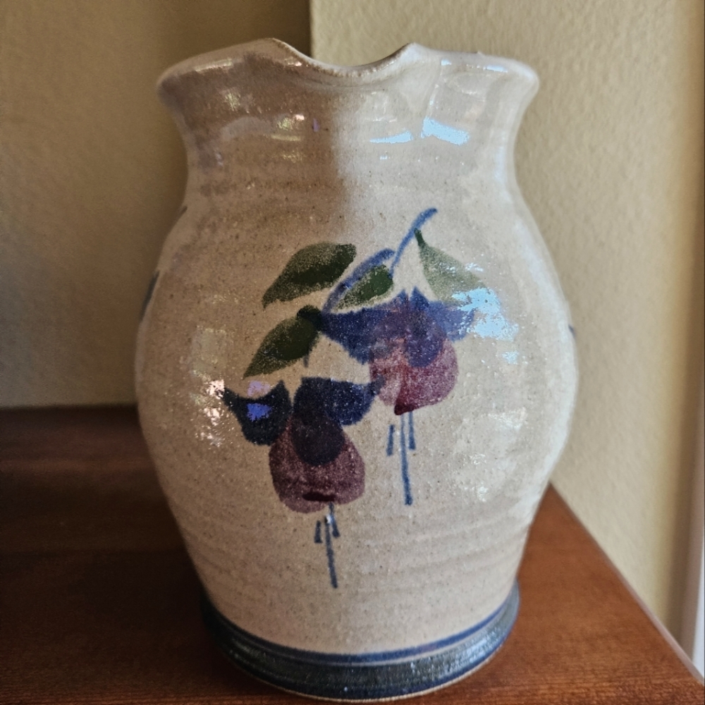 Handmade salt glaze pitcher with hand painted fushia floral.